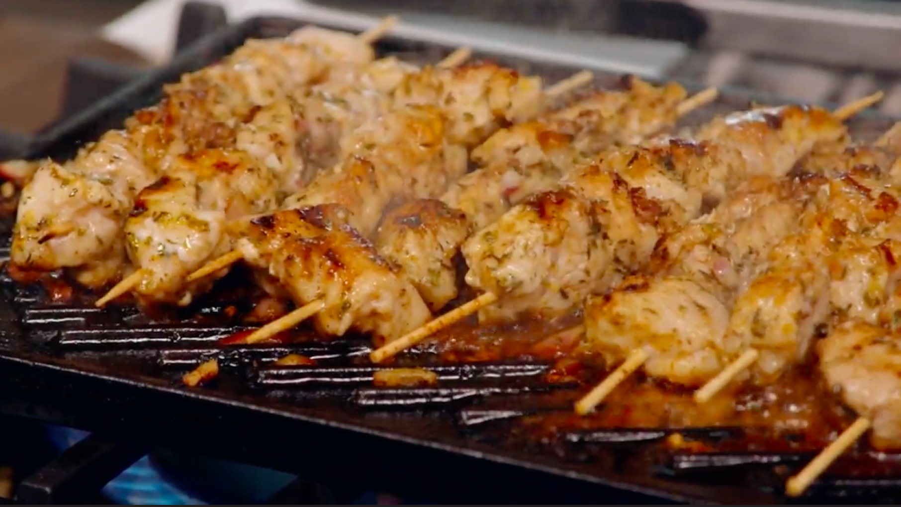 Pork Souvlakia on skewers on a grill